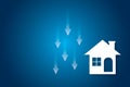 White paper houses with arrow down on blue background. Concept for low cost real estate. Lower mortgage interest rates. Royalty Free Stock Photo