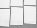 White paper mock-ups isolated on gray background, Blank portrait paper A4. brochure newspaper magazine, can use poster Royalty Free Stock Photo