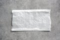 White paper napkin on grey stone table top view,food advertisement element,empty space blank.Baking paper piece Royalty Free Stock Photo