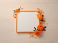 White paper with orange outline for writing messages with orange poppies and leaves. Royalty Free Stock Photo