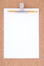 White Paper, Paperclip and Pencil over cork surfac Royalty Free Stock Photo