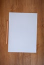 White paper and pencil on wood table Royalty Free Stock Photo