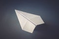 White paper plane origami isolated on a grey background Royalty Free Stock Photo