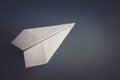 White paper plane origami isolated on a grey background Royalty Free Stock Photo
