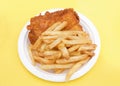 Fish and chips on a white paper plate Royalty Free Stock Photo