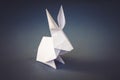 White paper rabbit origami isolated on a grey background Royalty Free Stock Photo