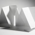White paper sculpture with sharp, angular folds creating a geometric, abstract form. Th Royalty Free Stock Photo
