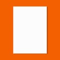 White paper sheet on orange wall Royalty Free Stock Photo