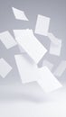 White Paper Sheets Floating on Grey Background Royalty Free Stock Photo