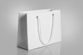 White Paper Shopping Bag on gray Background Royalty Free Stock Photo