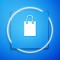 White Paper shopping bag icon isolated on blue background. Package sign. Blue square button. Vector Illustration Royalty Free Stock Photo