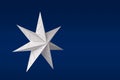 White paper star on blue Royalty Free Stock Photo