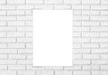 White paper sticked on white brick wall