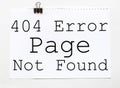 White paper with text 404 Error Page Not Found on a white background with stationery