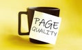 White paper with text Page Quality on the black cup Royalty Free Stock Photo