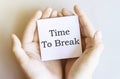 White paper with text Time To Break in male hands on a white background Royalty Free Stock Photo