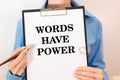 White paper with text Words have power lying on the keyboard. Royalty Free Stock Photo