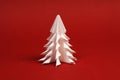 White paper tree on red background