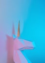 White paper unicorn head in vibrant bold gradient holographic colors. Minimal art fantasy concept