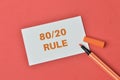 White paper written with 80 20 rule over red background