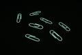 white paperclips in black background Royalty Free Stock Photo