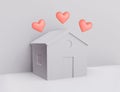 White papercraft house with hearts, beloved family home concept
