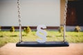 White paragraph symbol on children chain swing.