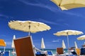 White parasols with blue sky and clouds. for summer seascape concept Royalty Free Stock Photo