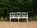 White park bench with hedge background Royalty Free Stock Photo