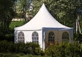 A white party tent spread out on the lawn Royalty Free Stock Photo