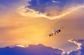 White passenger airplane flying away in to sky high altitude with iridescence cloud or rainbow cloud