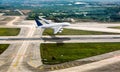 White passenger double decker plane in flight. The plane takes off from the airport runway. Airplane aerial and side view