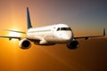 White passenger jet plane flies above the clouds in the sunset light Royalty Free Stock Photo