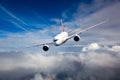 Passenger aircraft flies against a background of a cloudy sky. Aircraft left inclination.