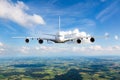 White double decker passenger plane in flight. Aircraft front view Royalty Free Stock Photo