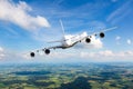 Passenger double decker plane flies against a background of a endless horizon. Aircraft left inclination / front view