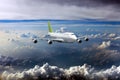 White passenger plane with green tail in flight.