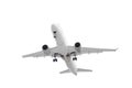 white passenger plane has released its landing gear and is landing isolated on white background with cliping path Royalty Free Stock Photo