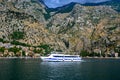 White passenger ship sails by sea along the coast Royalty Free Stock Photo