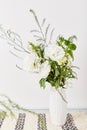 White pastel bouquet of eustoma, rose, gypsophila. Biophilic interior, cozy aesthetic table at home
