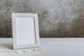 White pastel frame with LOVE letter on the white wooden table with black background. Minimal and simple composition for wallpaper. Royalty Free Stock Photo