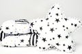 White patchwork feather comforter with black and gold stars and black stripes and white star shaped soft pillow with black s