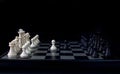 White pawn and black pawn on chess table. Black chess set in order for game start. Royalty Free Stock Photo