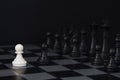 White pawn and black pawn on chess table. Black chess set in order for game start. Royalty Free Stock Photo