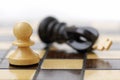 White Pawn Standing Over Defeated King. Royalty Free Stock Photo