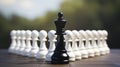 Among white pawns, the black queen embodies the business concept of standing out for selection