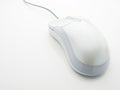 White PC mouse on white table top