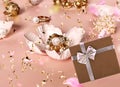 White pearl gold jewelry and gift box with pink roses petal seashell  still life pink and black background Royalty Free Stock Photo