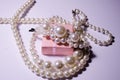 White pearl jewelry. Luxury jewelry for women and girls. Hair clip and pearl necklace. Artificial pearls. Snow-white