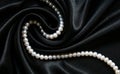 White pearls on the black silk as background Royalty Free Stock Photo